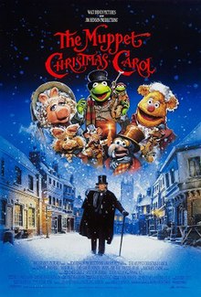 Scrooge stands in snowy England while the Muppets hover joyfully overhead.